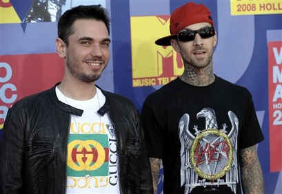 Musician Travis Barker, right, and Adam Goldberg "DJ AM " arrive at the 2008 MTV Video Music Awards held at Paramount Pictures Studio Lot on Sunday, Sept. 7, 2008, in Los Angeles. (AP Photo/Chris Pizzello)