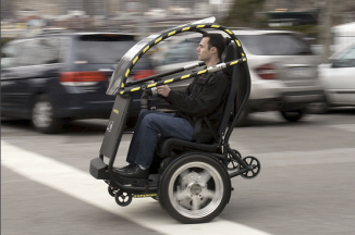 The Project P.U.M.A. (Personal Urban Mobility and Accessibility) prototype is shown in Brooklyn April 4. GM and Segway say the vehicle could allow people to travel around cities more quickly, safely, quietly and cleanly, and at a lower total cost.
